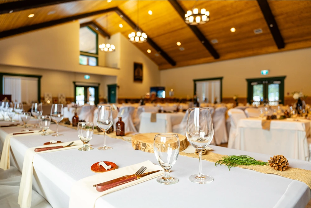 Close-up of decorated tables in the Alpine Room, showcasing an elegant event setup.
