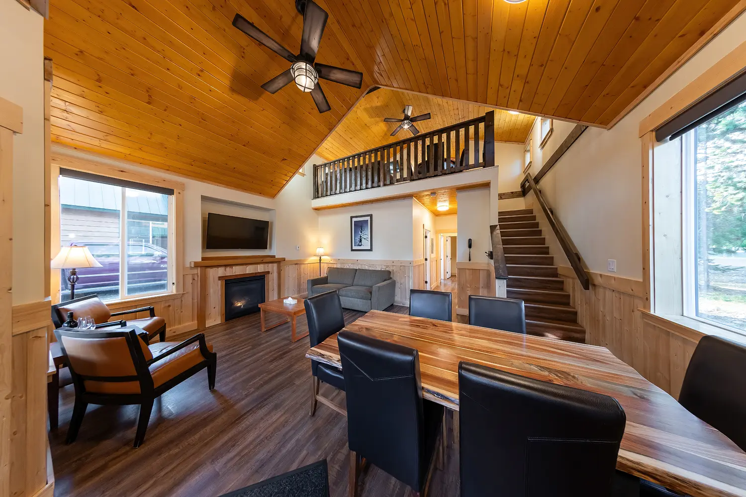 Cozy living room inside the Manning Park Resort Premium Cabin, featuring warm furnishings and rustic charm.