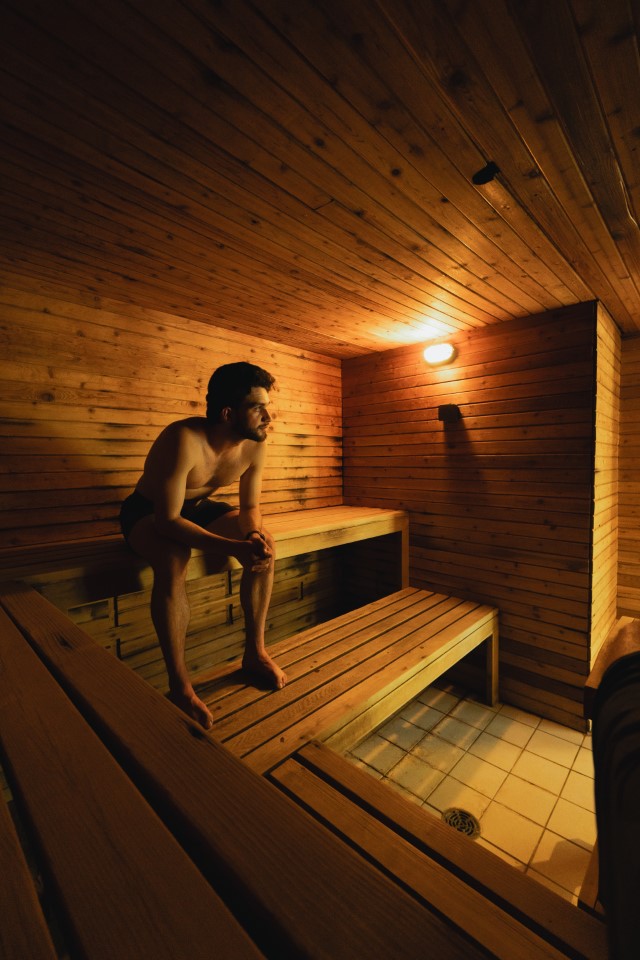 Man relaxing in a sauna at Manning Park Resort’s Loon Lagoon.