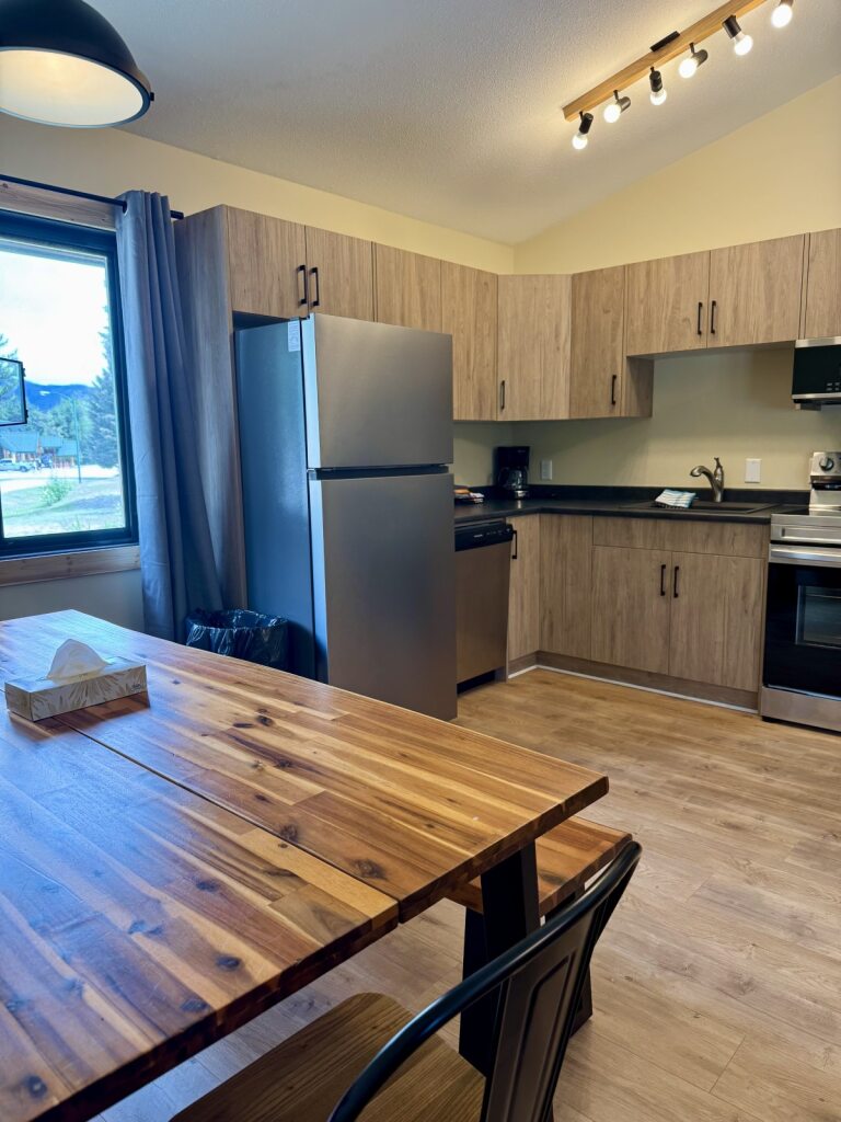 Full kitchen in a Manning Park Resort Deluxe Cabin, equipped for a cozy mountain stay.