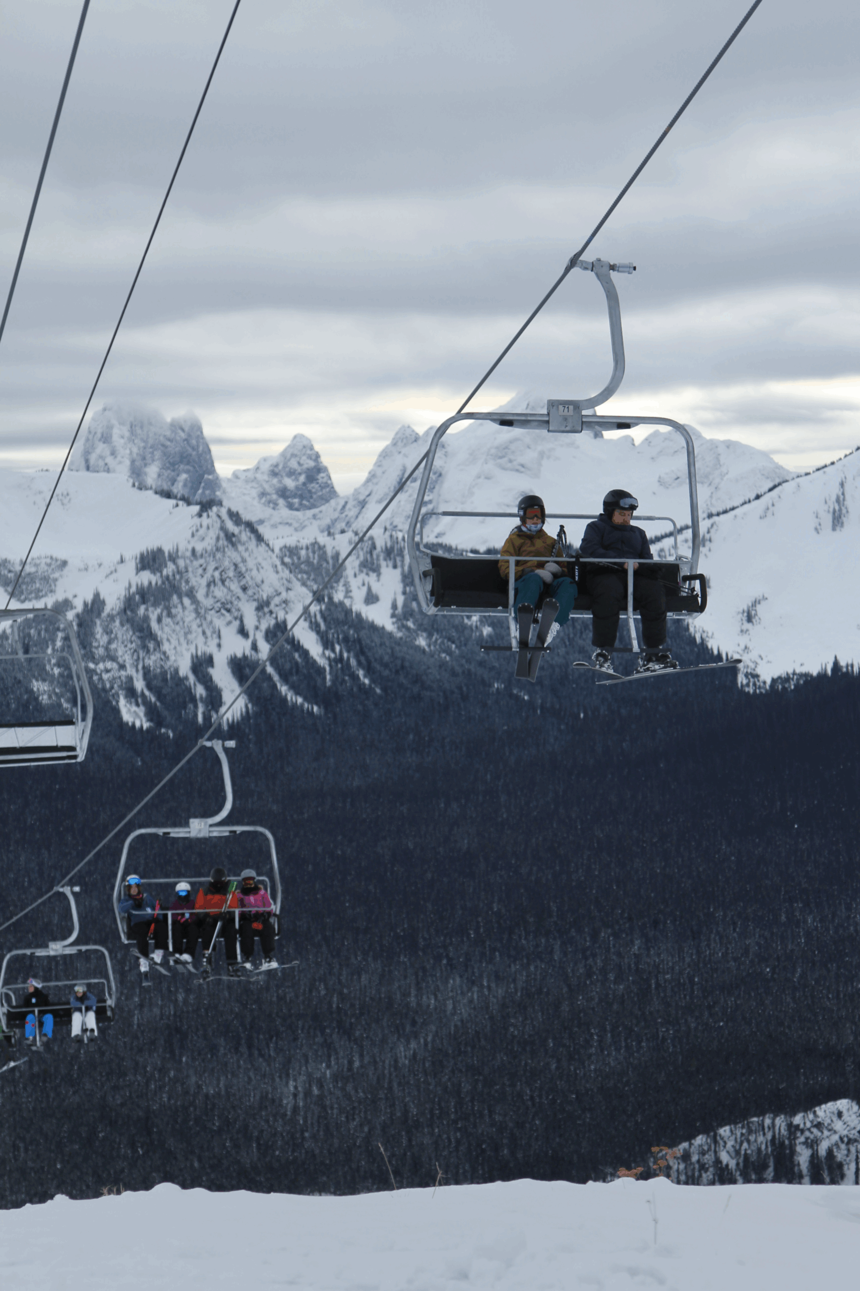 Guests enjoying a scenic ride on a ski lift at Manning Park Resort.