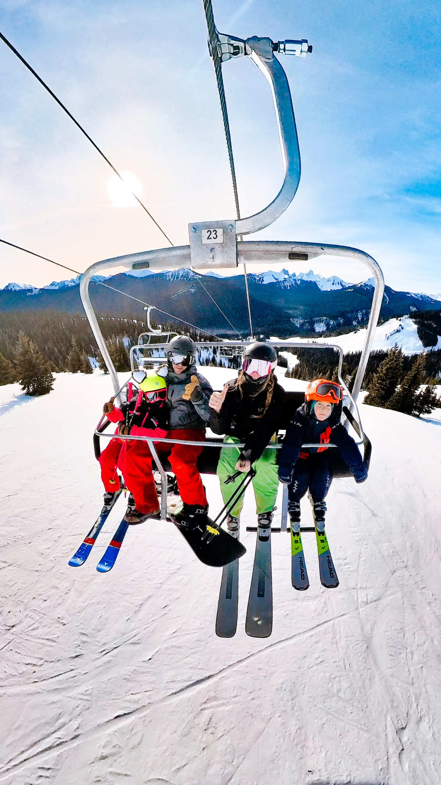 Family riding the Bear Chair ski lift at Manning Park Resort.